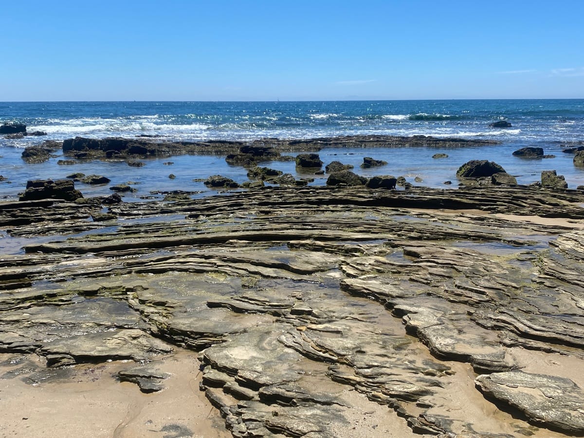 Rocky tide pools along the shoreline at Crystal Cove State Park